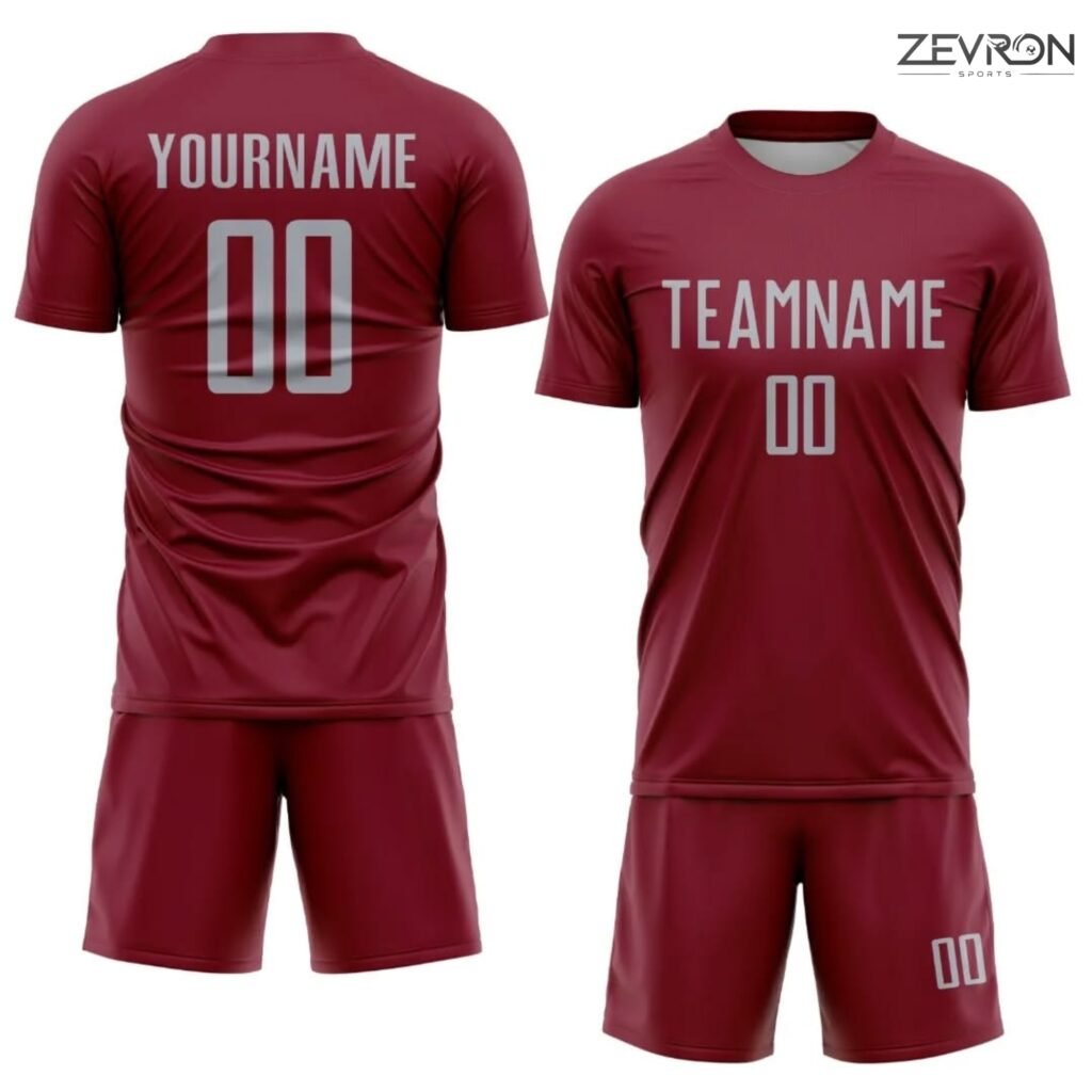Professional maroon tennis uniform set with silver custom name and numbering by Zevron Sports.