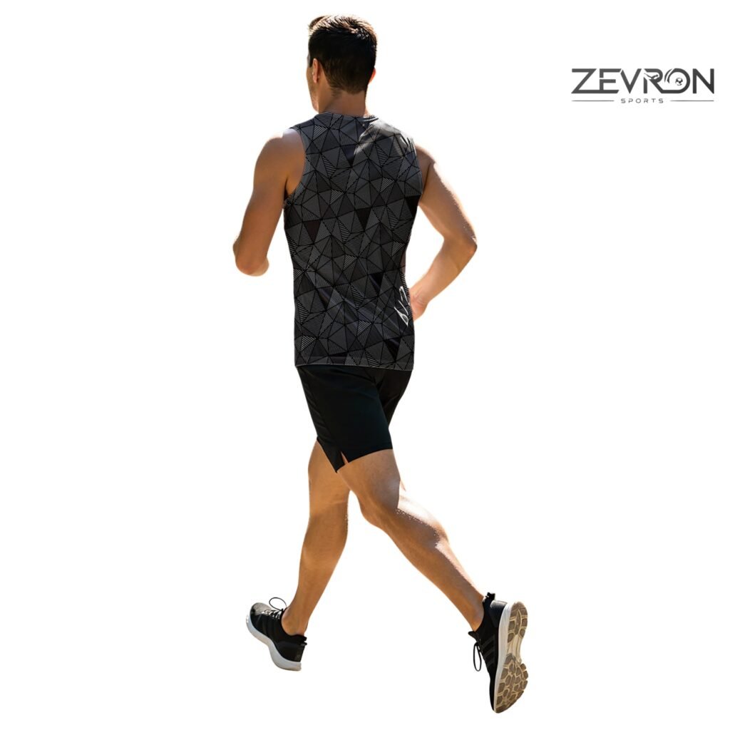 Back view of a runner wearing a Zevron Sports black and grey geometric patterned sleeveless tank top and black shorts.
